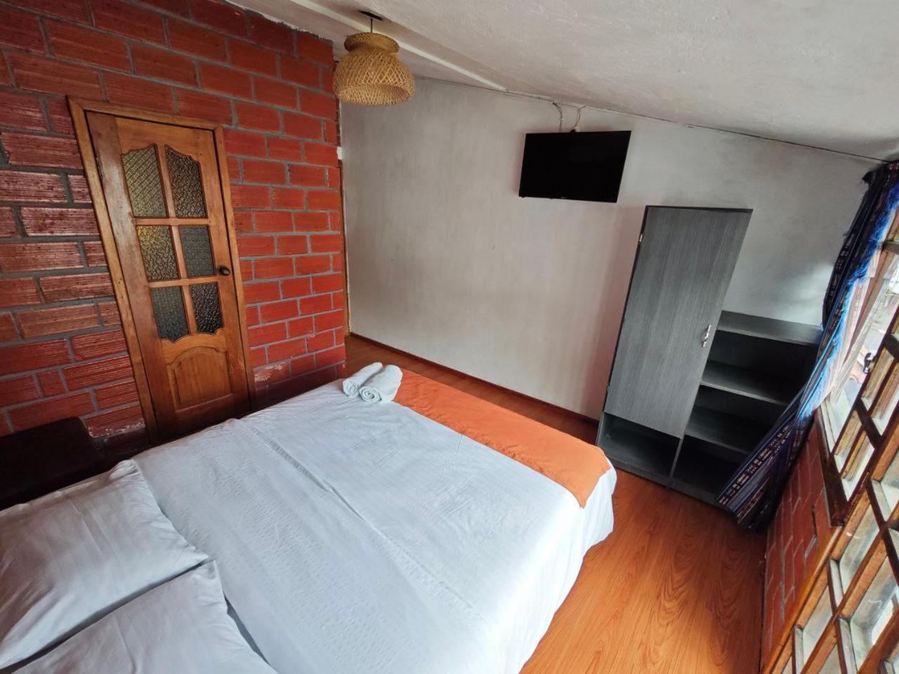 Garden House Hostal بانيوس المظهر الخارجي الصورة