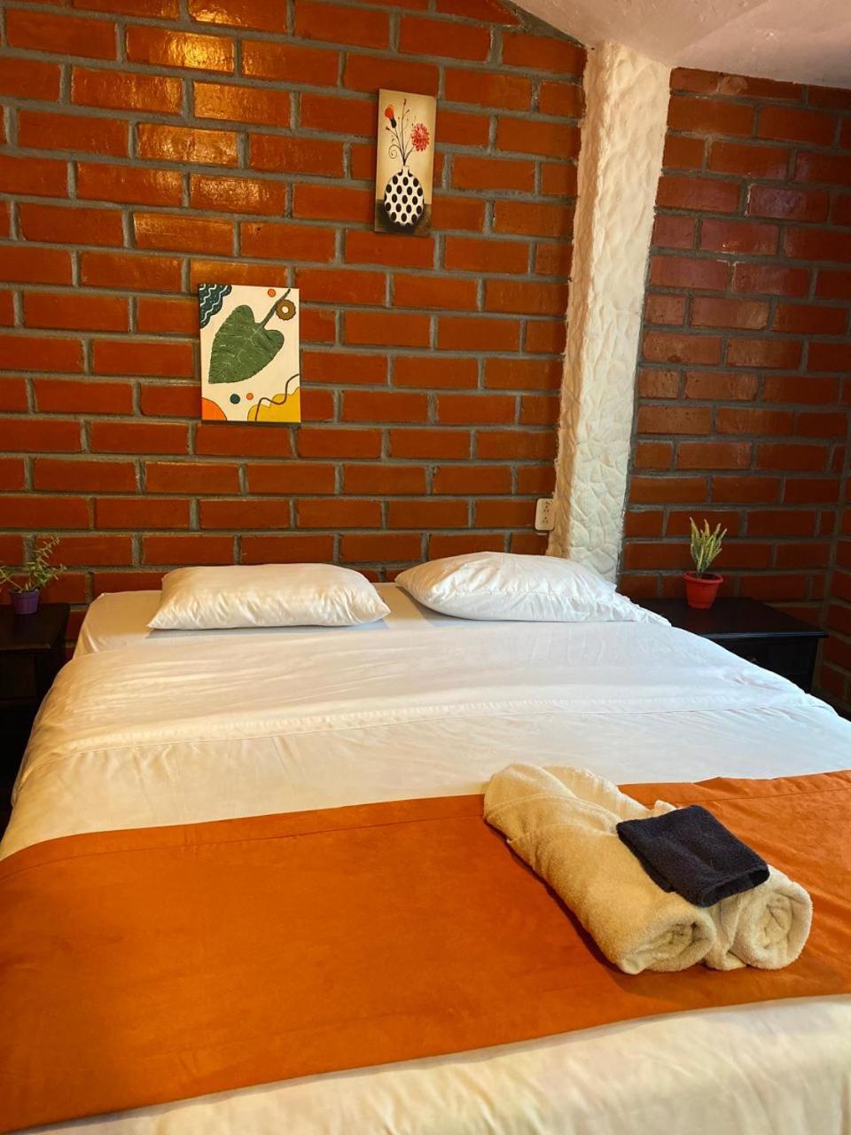 Garden House Hostal بانيوس المظهر الخارجي الصورة